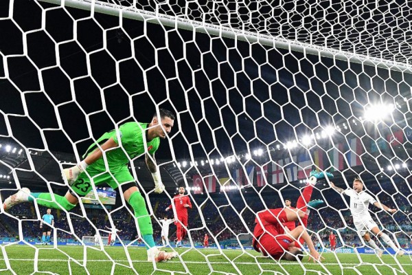 Turkey's defender Merih Demiral (2R) scores an owngoal during the UEFA EURO 2020 Group A football match between Turkey and Italy at the Olympic Stadium in Rome on June 11, 2021. (Photo by Filippo MONTEFORTE / AFP)