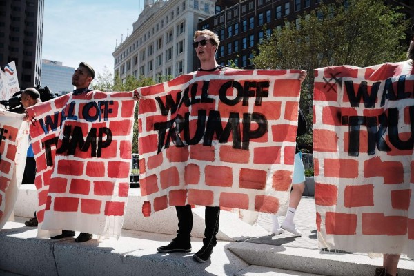 CLEVELAND, OH - JULY 20: Protesters demonstrate against Donald Trump near the site of the Republican National Convention (RNC) in downtown Cleveland on the third day of the convention on July 20, 2016 in Cleveland, Ohio. Many people have stayed away from downtown due to road closures and the fear of violence. An estimated 50,000 people are expected in Cleveland, including hundreds of protesters and members of the media. The four-day Republican National Convention kicked off on July 18. Spencer Platt/Getty Images/AFP