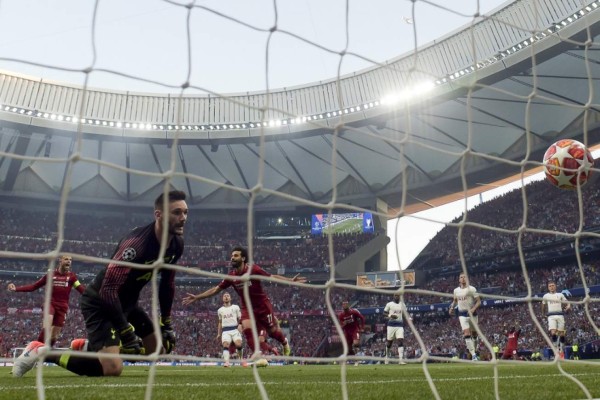 Liverpool's Egyptian forward Mohamed Salah (3L) celebrates after scoring the opening goal during the UEFA Champions League final football match between Liverpool and Tottenham Hotspur at the Wanda Metropolitano Stadium in Madrid on June 1, 2019. (Photo by GABRIEL BOUYS / AFP)