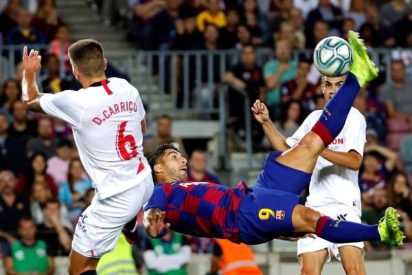 Barcelona's French forward Ousmane Dembele celebrates scoring the opening goal during Spanish Copa del Rey (King's Cup) semi-final second leg football match between FC Barcelona and Sevilla FC at the Camp Nou stadium in Barcelona on March 3, 2021. (Photo by Josep LAGO / AFP)
