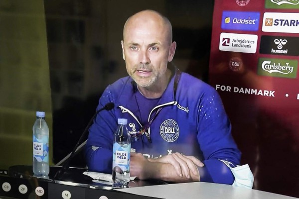 Denmark's national team doctor Morten Boesen is seen on a screen during a digital press conference from Denmark's national football team's training grounds in Elsinore on June 13, 2021, a day after the teams' midfielder Christian Eriksen collapsed on the pitch during their UEFA EURO 2020 Group B football match against Finland. - Denmark's team doctor said on Juner 13 there was still 'no explanation' for why midfielder Christian Eriksen collapsed during his country's opening Euro 2020 game against Finland. Pictures are taken from a video livestream with the permission from DBU, Danish Football Union. (Photo by Mads Claus Rasmussen / Ritzau Scanpix / AFP) / Denmark OUT