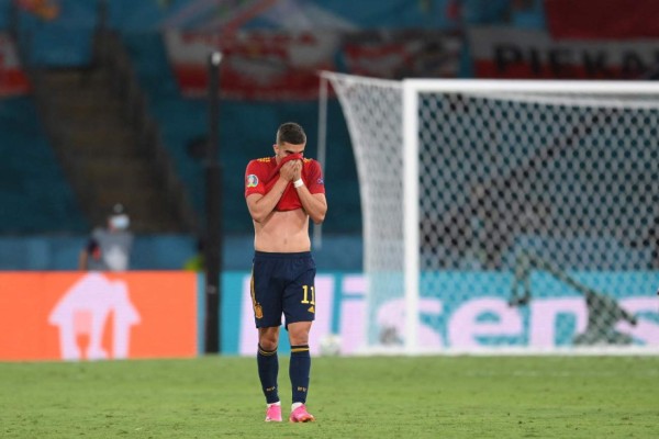 Spain's midfielder Ferran Torres reacts at the end of the UEFA EURO 2020 Group E football match between Spain and Poland at La Cartuja Stadium in Seville, Spain, on June 19, 2021. (Photo by David Ramos / POOL / AFP)