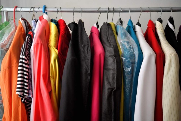 Pachuco style suits known as 'Zoot Suit' are photographed in a house of a Pachuco in Tepito neighborhood in Mexico City on August 22, 2017. Wearing their feathered hats, colorful tank tops, gold chains on the lapel and patent leather shoes, the Pachucos - the subculture that characterized Mexican gangs set up in the United States in the 1940s - continue to dance to the rhythm of legendary mambo Salons in Mexico. / AFP PHOTO / YURI CORTEZ / TO GO WITH AFP STORY by YEMELI ORTEGA