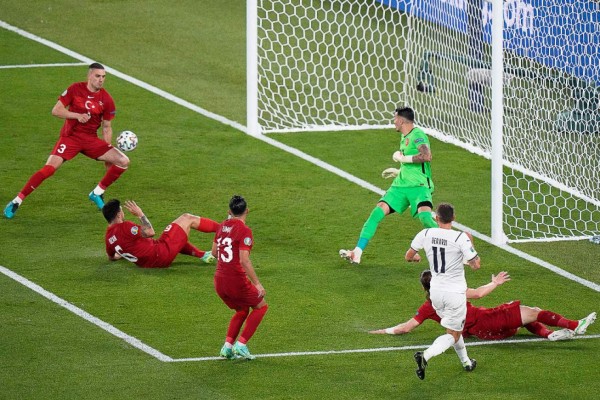 Turkey's defender Merih Demiral (L) scores an owngoal during the UEFA EURO 2020 Group A football match between Turkey and Italy at the Olympic Stadium in Rome on June 11, 2021. (Photo by Andrew Medichini / POOL / AFP)