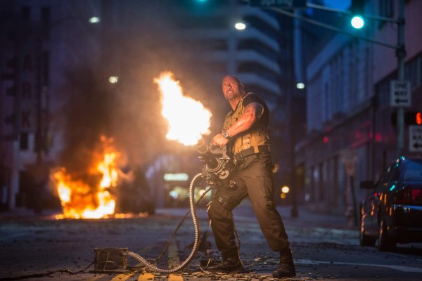 UNDATED -- BC-HOLLYWOOD-WATCH-DWAYNE-JOHNSON-ART-NYTSF -- A Hot Time in the Old Town Tonight: Dwayne Johnson lights it up in a scene from the international hit “Furious 7.” (CREDIT: Photo by Scott Garfield. Copyright 2015 Universal Pictures.)--ONLY FOR USE WITH ARTICLE SLUGGED -- BC-HOLLYWOOD-WATCH-DWAYNE-JOHNSON-ART-NYTSF -- OTHER USE PROHIBITED.