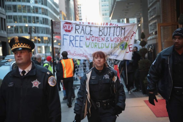 CHICAGO, IL - MARCH 07: Police lead the way as demonstrators protesting to support International Women's Day and against the administration of President Donald Trump march through the Loop on March 7, 2017 in Chicago, Illinois. The demonstrators have vowed to protest in Chicago every Tuesday for the first 100 days of the Trump administration. Scott Olson/Getty Images/AFP== FOR NEWSPAPERS, INTERNET, TELCOS & TELEVISION USE ONLY ==