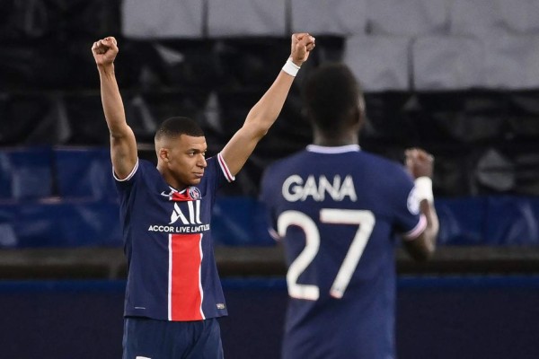 (From L) Paris Saint-Germain's French forward Kylian Mbappe, Paris Saint-Germain's Senegalese midfielder Idrissa Gueye celebrate after winning the UEFA Champions League quarter-final second leg football match between Paris Saint-Germain (PSG) and FC Bayern Munich at the Parc des Princes stadium in Paris, on April 13, 2021. (Photo by FRANCK FIFE / AFP)