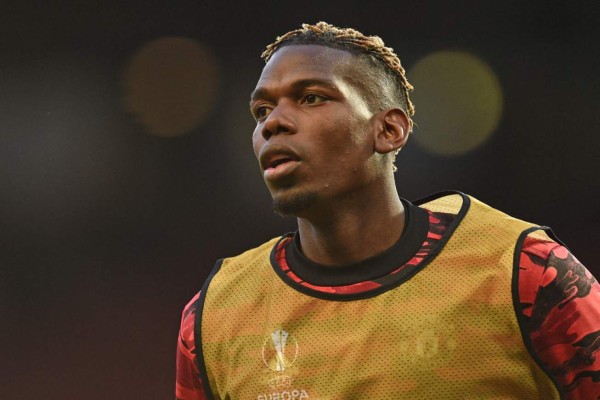 Manchester United's French midfielder Paul Pogba warms up ahead of the UEFA Europa league quarter final, second leg football match between Manchester United and Granada at Old Trafford stadium in Manchester, north west England, on April 15, 2021. (Photo by Oli SCARFF / AFP)