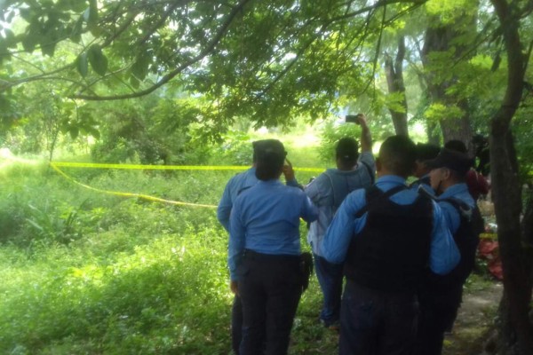 Encuentran dos cuerpos semienterrados en La Ceiba