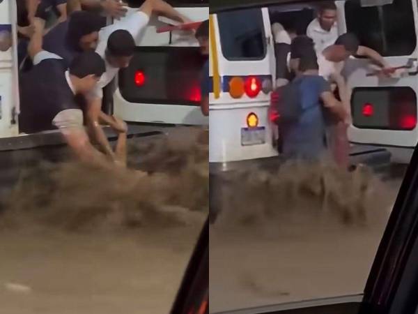Ciudadanos intentan rescatar a una mujer que fue arrastrada por la fuerte corriente de agua en el bulevar del Sur de San Pedro Sula durante las intensas lluvias registradas este viernes.