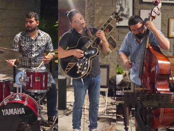 Músicos de Jazz Guitar Trio, que deleitaron a los presentes con varias piezas musicales.