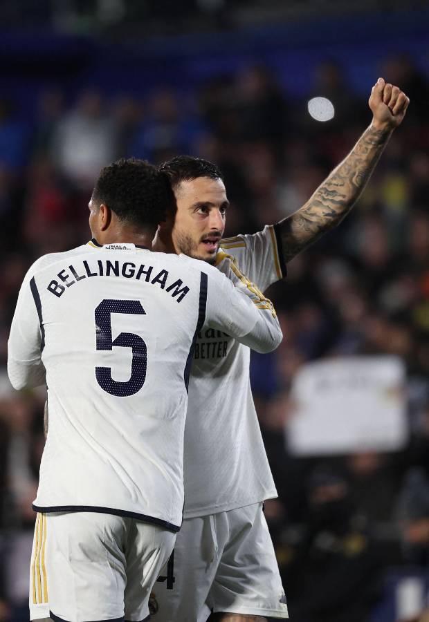 Joselu festejando uno de sus goles con Jude Bellingham.