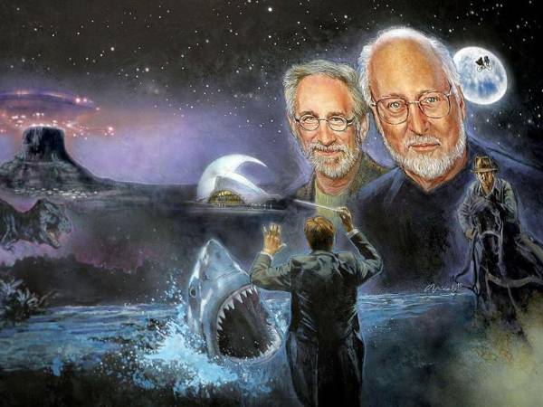 Fotografía de archivo de un mural con retratos del compositor John Williams y el director de cine Steven Spielberg y referencias a las películas en las que han trabajado juntos, entre esas ‘Tiburón’.