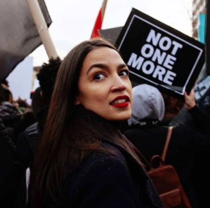 US Congresswoman Alexandria Ocasio-Cortez(D-NY) listens as Michael Cohen, attorney for President Trump, testifies before the House Oversight and Reform Committee in the Rayburn House Office Building on Capitol Hill in Washington, DC on February 27, 2019. (Photo by MANDEL NGAN / AFP) (Photo credit should read MANDEL NGAN/AFP/Getty Images)