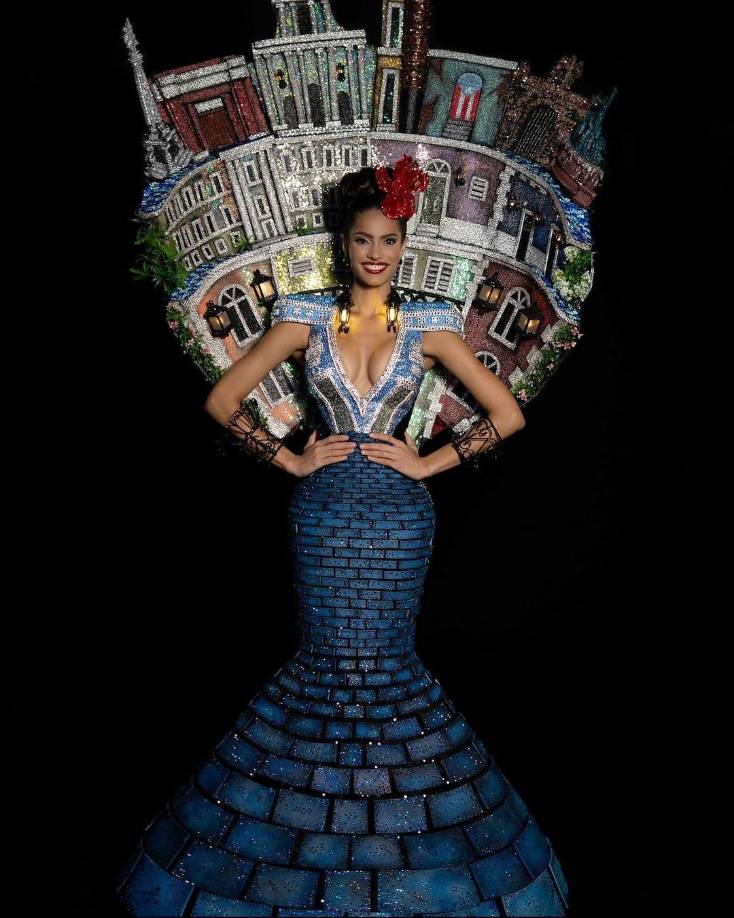 La vestimenta está compuesta con una falda elaborada en terciopelo y lentejuelas negras en un elegante corte trompeta. 