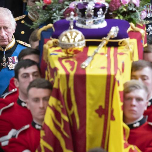 King Charles III and members of the royal family follow the coffin of Queen Elizabeth II, draped in the Royal Standard with the Imperial State Crown and the Sovereign's orb and sceptre, as it is carried out of Westminster Abbey after her State Funeral on September 19, 2022. (Photo by Danny Lawson / POOL / AFP)