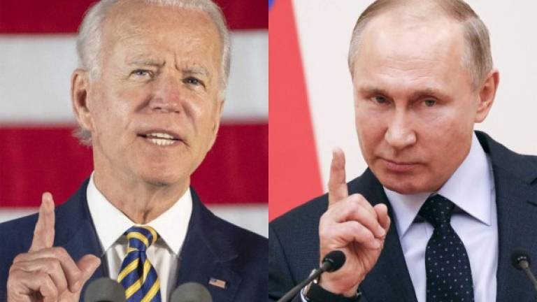 Esta combinación de imágenes de archivos muestra al entonces candidato presidencial demócrata Joe Biden y al presidente ruso Vladimir Putin. Fotos AFP