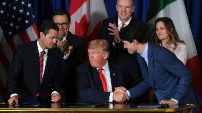 El presidente de México Peña Nieto y sus homólogos, el presidente de EEUU, Donald Trump y el primer ministro canadiense Justin Trudeau. AFP
