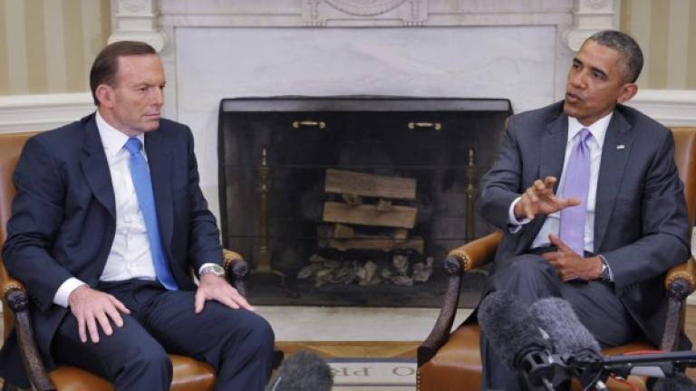 El presidente Obama, derecha, recibió al primer ministro australiano Tony Abbott ayer en la Casa Blanca.