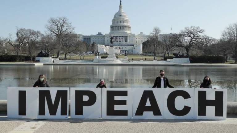 Los demócratas impulsan por segunda vez un proceso de juicio político contra Trump, este último tras los incidentes en el Capitolio de EEUU. FOTO AFP