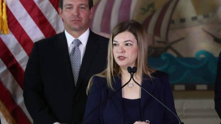 MIAMI, FLORIDA - JANUARY 09: Newly sworn-in Gov. Ron DeSantis stands behind Barbara Lagoa as she speaks after he named her to the Florida Supreme Court on January 09, 2019 in Miami, Florida. Mr. DeSantis was sworn in yesterday as the 46th governor of the state of Florida.(Photo by Joe Raedle/Getty Images,)