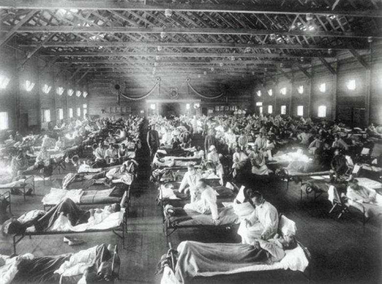 Mandatory Credit: Photo by Everett/Shutterstock (10411001a)<br/>1918 Spanish influenza ward at Camp Funston, Kansas, showing the many patients ill with the flu. It is theorized that the virus strain originated at Camp Funston, and the soldiers sent out after training spread the disease<br/>1918 Spanish influenza ward at Camp Funston, Kansas, showing the many patients ill with the flu. It