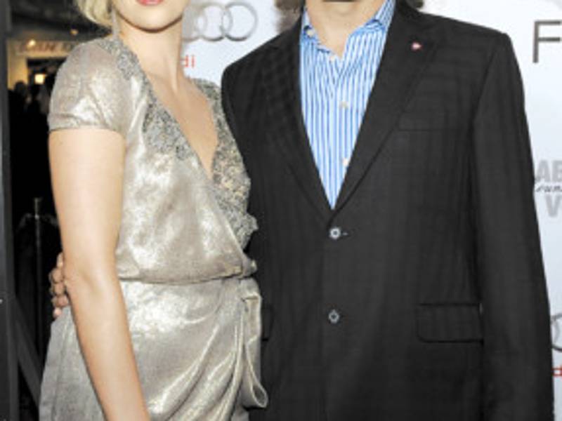 Charlize Theron, left, and Viggo Mortensen, cast members in 'The Road,' pose together at the premiere of the film at AFI Fest 2009 in Los Angeles, Wednesday, Nov. 4, 2009. (AP Photo/Chris Pizzello)