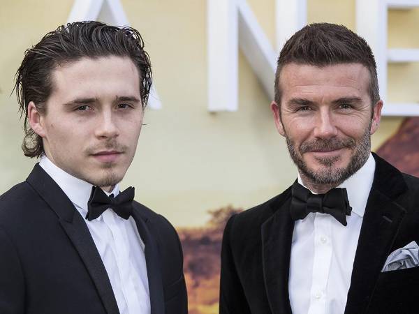 Brooklyn Beckham y su padre David, en una foto de archivo.