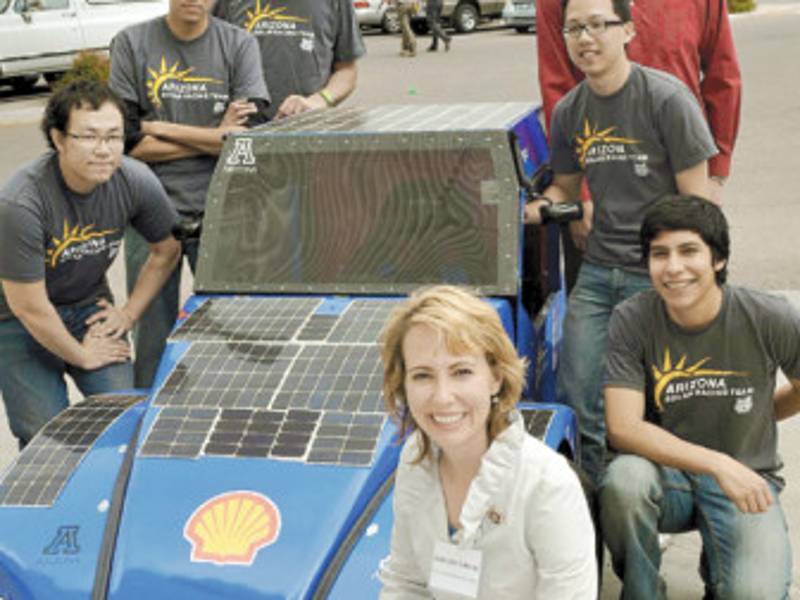 This undated handout image courtesy of Giffords For Congress website shows Rep. Gabrielle Giffords posing with the University of Arizona Solar Team. Giffords was in critical condition January 9, 2011 after being shot in the head Saturday by a gunman who opened fire in Tucson, Arizona, killing six people including a federal judge. Giffords was hosting a 'Congress on Your Corner' event with constituents at when the gunman attacked, killing six and wounding 12, according to police spokesman Rick Kastigar. AFP PHOTO/HO/GIFFORDS FOR CONGRESS == RESTRICTED TO EDITORIAL USE - NOT FOR SALE FOR MARKETING OR ADVERTISING CAMPAIGN ==