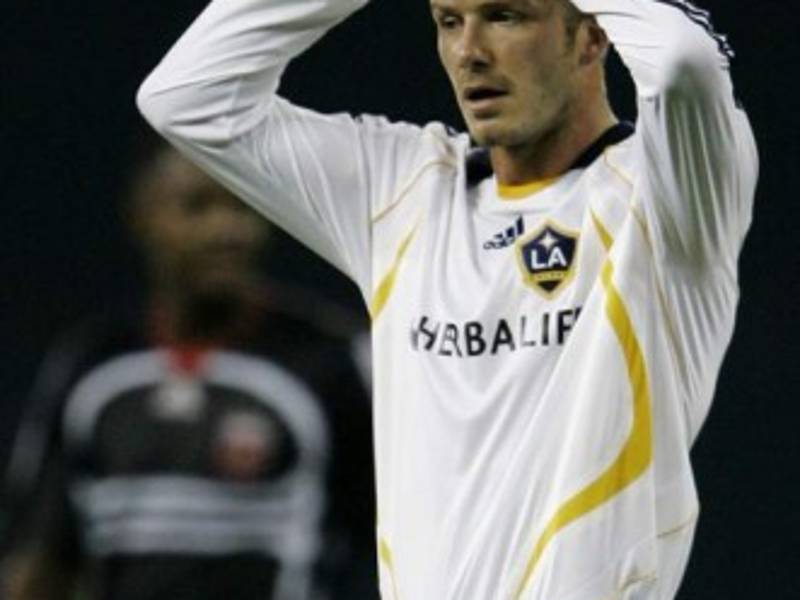 Los Angeles Galaxy midfielder David Beckham reacts after his teammate missed a goal during the second half of MLS soccer game against DC United, Thursday, Aug. 9, 2007, in Washington. (AP Photo/Haraz N. Ghanbari)