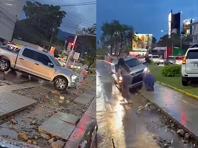 Varios vehículos quedaron atascados en las zanjas abiertas en el bulevar Los Próceres, en San Pedro Sula.