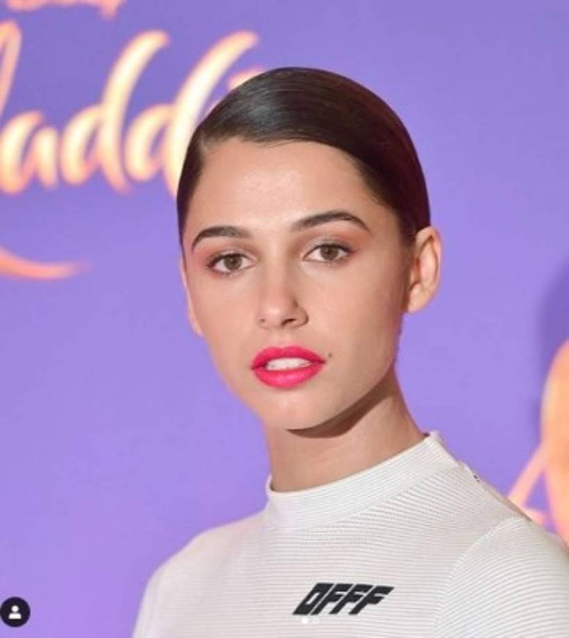 Nació en Londres en 1993 es hija de padre británico y madre india. La actriz de 26 años empezó su carrera como cantante en la Bridge Church Youth Band.