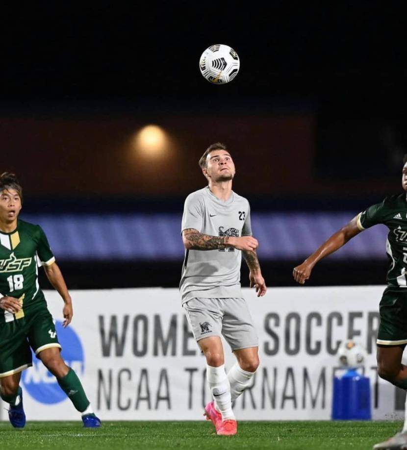 Mikey ha militado en ligas estatales, siendo campeón de las últimas tres ediciones de la Conferencia Americana del fútbol universitario en el país. 