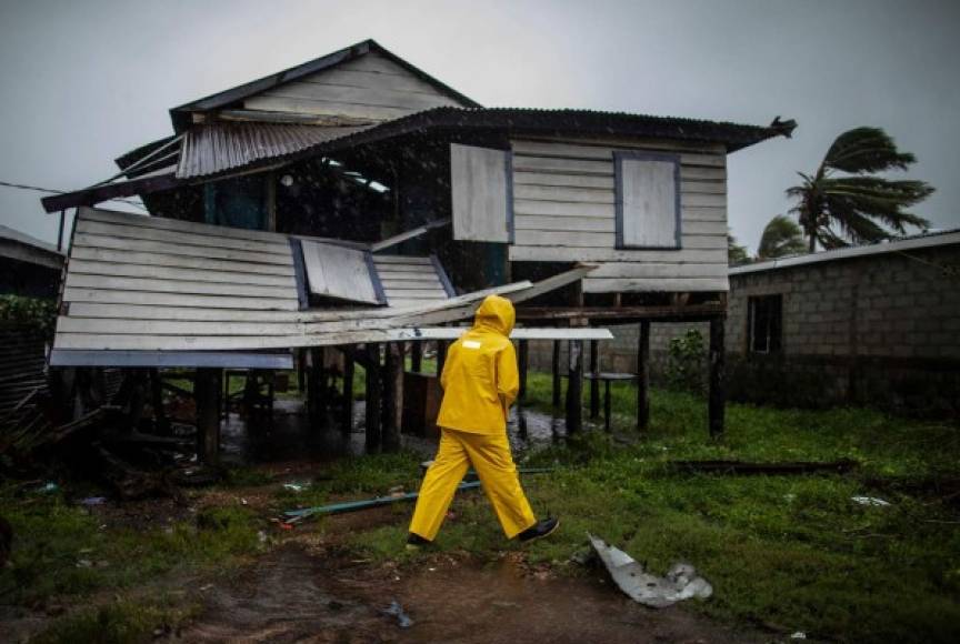 TOPSHOT - A man looks at a damaged house after the passage of Hurricane Iota, in Bilwi, Puerto Cabezas, Nicaragua, on November 17, 2020. - Storm Iota has killed at least nine people as it smashed homes, uprooted trees and swamped roads during its destructive advance across Central America, authorities said Tuesday, just two weeks after Hurricane Eta devastated parts of the region. (Photo by STR / AFP)