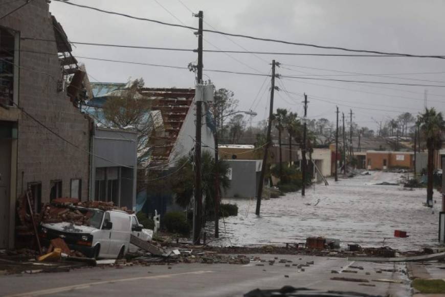 PANAMA CITY, FL - OCTOBER 10: Damaged buildings and a flooded street are seen after hurricane Michael passed through the downtown area on October 10, 2018 in Panama City, Florida. The hurricane hit the Florida Panhandle as a category 4 storm. Joe Raedle/Getty Images/AFP