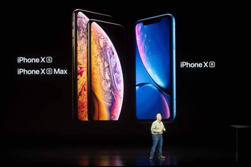 (FILES) In this file photo taken on September 12, 2018 Phil Schiller, Apple senior vice president, discusses his company's iPhone line-up during an event in Cupertino, California. - A German court on December 20, 2018 found in favour of US chipmaker Qualcomm in a patent dispute case against Apple, which could lead to a ban on sales of iPhones in Germany. (Photo by NOAH BERGER / AFP)