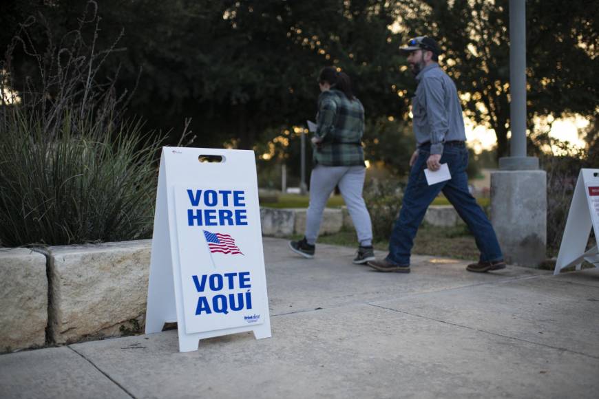 Voters walk into a polling place at SSGT Willie de Leon Civic Center, in Uvalde, Texas, on November 8, 2022. (Photo by Mark Felix / AFP)
