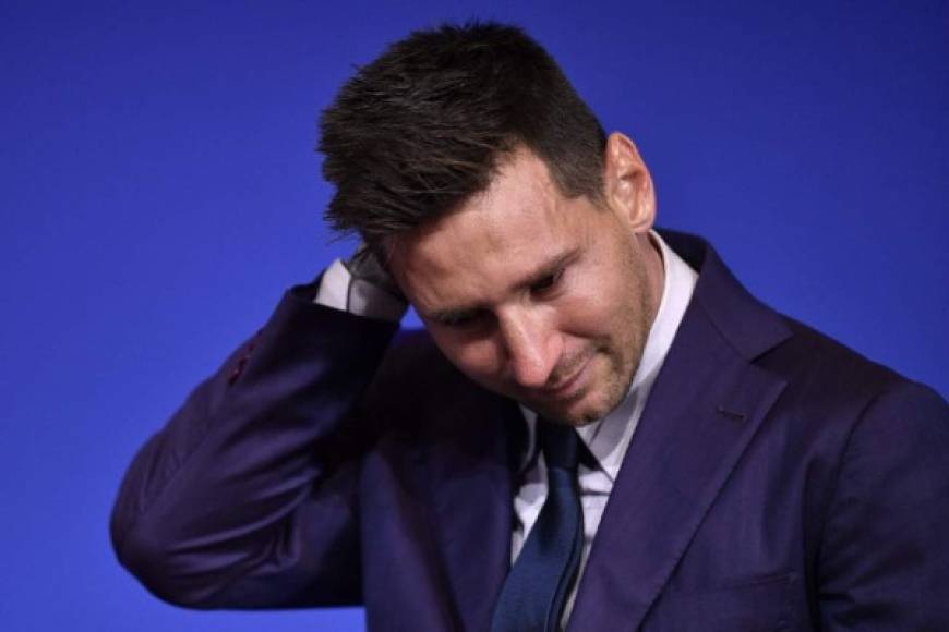 Barcelona's Argentinian forward Lionel Messi cries during a press conference at the Camp Nou stadium in Barcelona on August 8, 2021. - The six-time Ballon d'Or winner Messi had been expected to sign a new five-year deal with Barcelona on August 5 but instead, after 788 games, the club announced he is leaving at the age of 34. (Photo by Pau BARRENA / AFP)