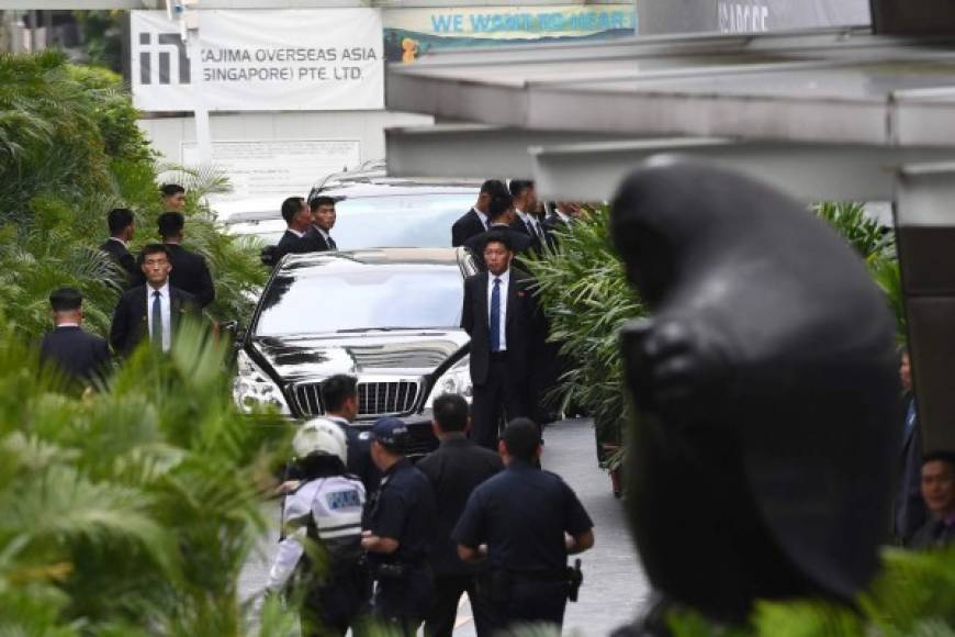 The motorcade carrying North Koran leader Kim Jong Un (not pictured) arrives at the St. Regis hotel ahead of the US-North Korea summit in Singapore on June 10, 2018. <br/>Kim Jong Un and Donald Trump will meet on June 12 for an unprecedented summit in an attempt to address the last festering legacy of the Cold War, with the US President calling it a 'one time shot' at peace. / AFP PHOTO / ADEK BERRY
