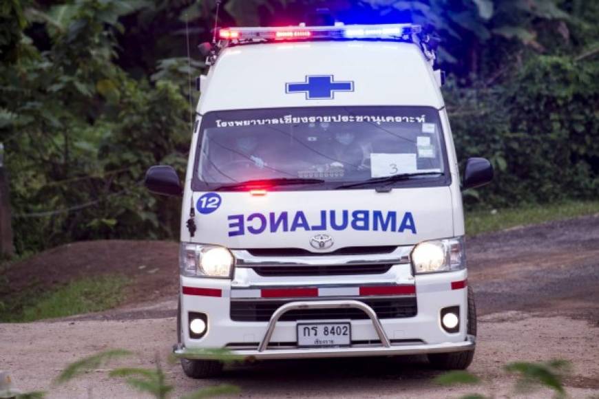 An ambulance leaves the Tham Luang cave area as operations continue for those still trapped inside the cave in Khun Nam Nang Non Forest Park in the Mae Sai district of Chiang Rai province on July 10, 2018.<br/>Rescuers raced to save four young footballers and their coach who remain trapped in a flooded Thai cave on July 10, as heavy rains threatened an already perilous escape mission that has seen eight of the boys extracted in 'good health'. / AFP PHOTO / YE AUNG THU