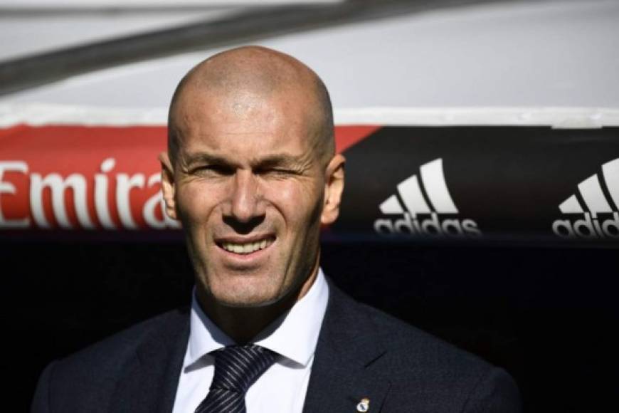 Real Madrid's French coach Zinedine Zidane grimaces before the Spanish league football match between Real Madrid CF and RC Celta de Vigo at the Santiago Bernabeu stadium in Madrid on March 16, 2019. (Photo by GABRIEL BOUYS / AFP)