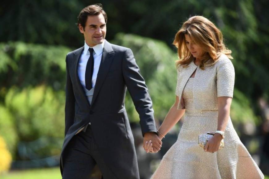 Swiss tennis player Roger Federer (L) and his wife Mirka attend the wedding of Pippa Middleton and James Matthews at St Mark's Church in Englefield, west of London, on May 20, 2017.<br/>Pippa Middleton hit the headlines with a figure-hugging outfit at her sister Kate's wedding to Prince William but now the world-famous bridesmaid is becoming a bride herself. Once again, all eyes will be on her dress as the 33-year-old marries financier James Matthews on Saturday at a lavish society wedding where William and Kate's children will play starring roles. / AFP PHOTO / POOL / Justin TALLIS
