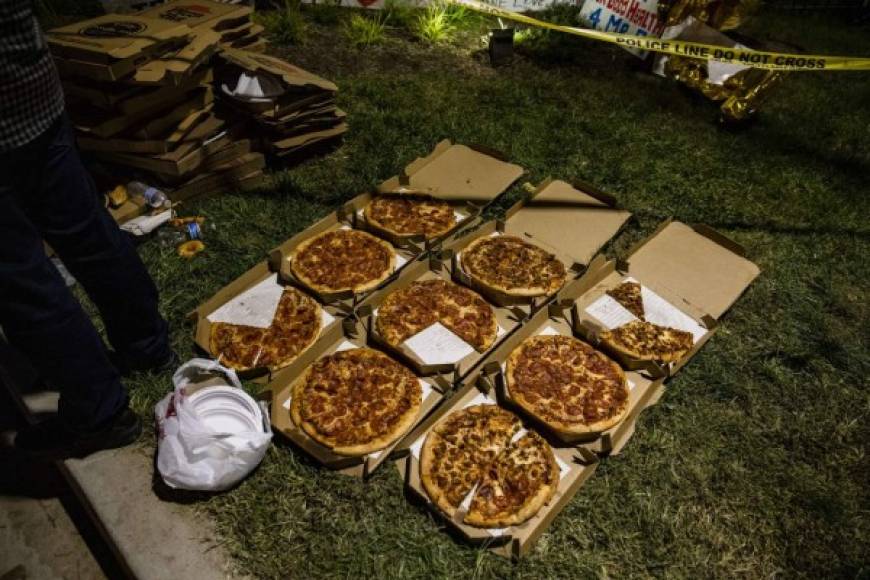BETHESDA, MD - OCTOBER 04: Pizzas are laid out for supporters of President Donald Trump outside Walter Reed National Military Medical Center where the President was admitted for treatment of COVID-19 on October 4, 2020 in Bethesda, Maryland. The President announced via Twitter early Friday morning that he had tested positive. Numerous other prominent GOP figures and members of Congress have also tested positive in the last few days. Samuel Corum/Getty Images/AFP<br/><br/>== FOR NEWSPAPERS, INTERNET, TELCOS & TELEVISION USE ONLY ==<br/><br/>