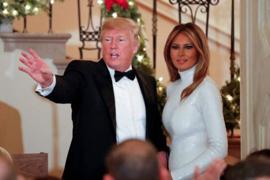 US President Donald Trump and First Lady Melania Trump (R) greet guests during the Congressional Ball at the White House in Washington DC on December 15, 2018. (Photo by ROBERTO SCHMIDT / AFP)