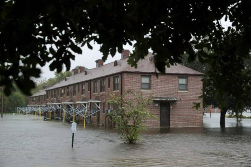 NEW BERN, NC - SEPTEMBER 13: The Trent Court public housing apartments are flooded after the Neuse River topped its banks during Hurricane Florence September 13, 2018 in New Bern, North Carolina. Coastal cities in North Carolina, South Carolina and Virginia are under evacuation orders as the Category 2 hurricane approaches the United States. Chip Somodevilla/Getty Images/AFP
