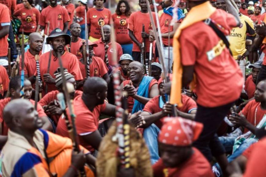 Workers attend a rally called by South Africa's largest union, the Congress of South African Trade Unions (COSATU), the South African Communist Party (SACP) and the African National Congress (ANC) to mark May Day - the International Workers' Day at the Sugar Ray Xulu stadium in Clermont township, north of Durban, on May 1, 2019. - Voting this year for the general election will mark 25 years since the end of apartheid rule. (Photo by RAJESH JANTILAL / AFP)