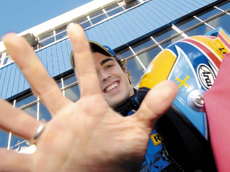 Renault's Fernando Alonso, from Spain, celebrates after winning the Formula One drivers championship following the Brazilian F1 Grand Prix at the Interlagos race track in Sao Paulo, Brazil Sunday, Oct. 22, 2006. Alonso's 2nd place finish in Brazil was enough to clinch the drivers championship for the 2nd year running. (AP Photos/Media Images/Anna Kalagani) ** REECE OUT **