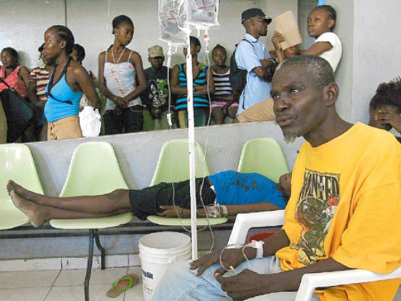 Haitians wait for treatment for cholera in the General Hospital on November 18, 2010 in Port-au-Prince. Gangs of angry Haitian youths trawled Port-au-Prince on Thursday as violence aimed at UN peacekeepers blamed for the cholera crisis spread to the capital after deadly rioting in the north. Organizers had urged people to vent their anger at the UN and the Haitian authorities in a demonstration at a main square by the presidential palace, but what transpired was more like urban guerrilla warfare. AFP PHOTO/HECTOR RETAMAL