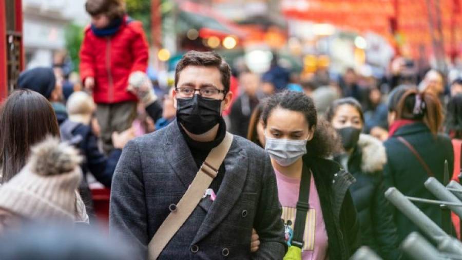 $!London, January 26, 2020. People wearing a face masks to protecting themself because of epidemic in China. Selective Focus. Concept of coronavirus quarantine. MERS-Cov, middle East respiratory syndrome coronavirus, Novel coronavirus 2019-nCoV.