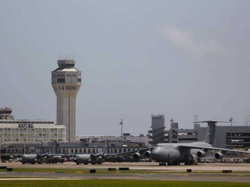 U.S. Military cargo planes are seen parked at the Luis Munoz Marin International Airport in the aftermath of Hurricane Maria, in San Juan, Puerto Rico, September 28, 2017.The US island territory, working without electricity, is struggling to dig out and clean up from its disastrous brush with the hurricane, blamed for at least 33 deaths across the Caribbean. / AFP PHOTO / Ricardo ARDUENGO